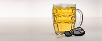 mug of beer next to a set of car keys
