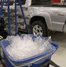 image of a cart full if plastic wrapping material in an automotive factory