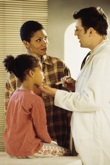 Mother and daughter at doctors office