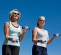 Women walking and lifting dumbbells