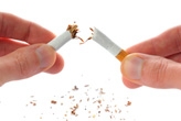 Hands breaking a cigarette