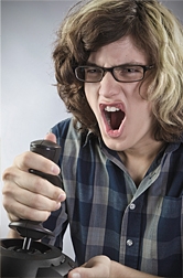 Teen boy playing video game