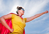 Woman with a cape under the sun