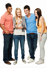 Four teenage friends text together.