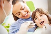 A young boy gets treated at the dentist.