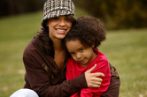 A mom comforts her child.